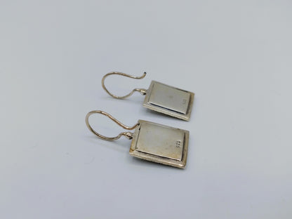 Silver earrings with an image of a painting