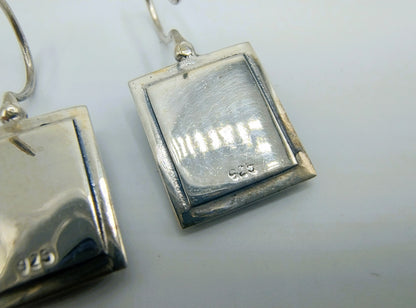 Silver earrings with an image of a painting