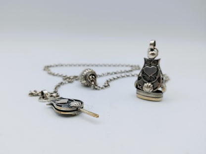 Silver men's chatelaine, Fa. Niekerk, Schoonhoven, 48 cm.
