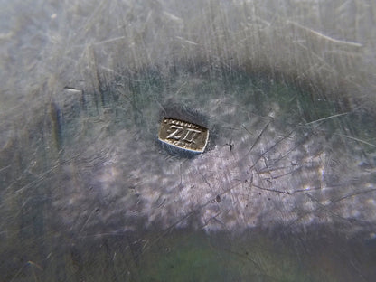 Silver pill box with a floral decoration