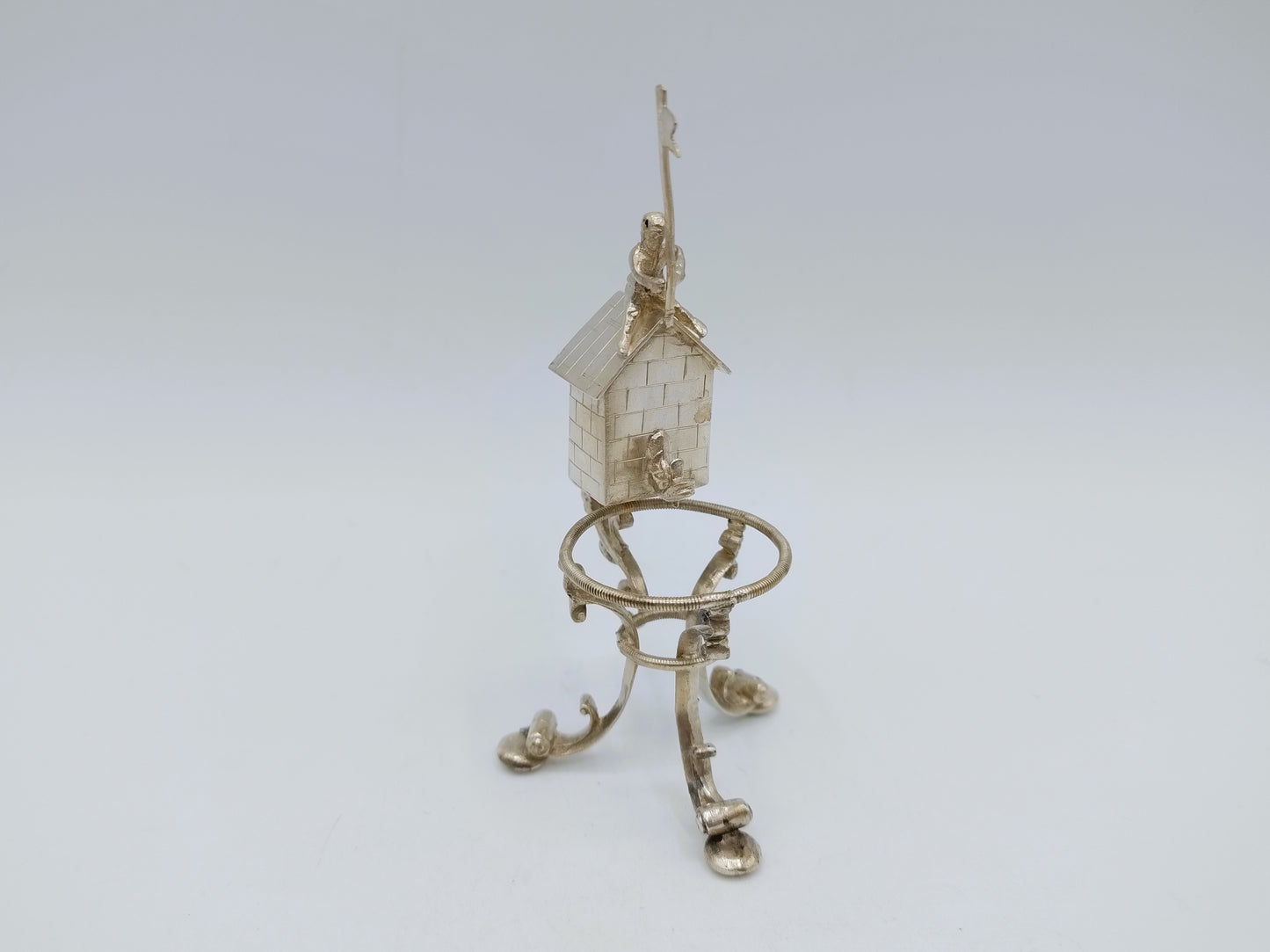 Silver miniature spring house with child, 19th century