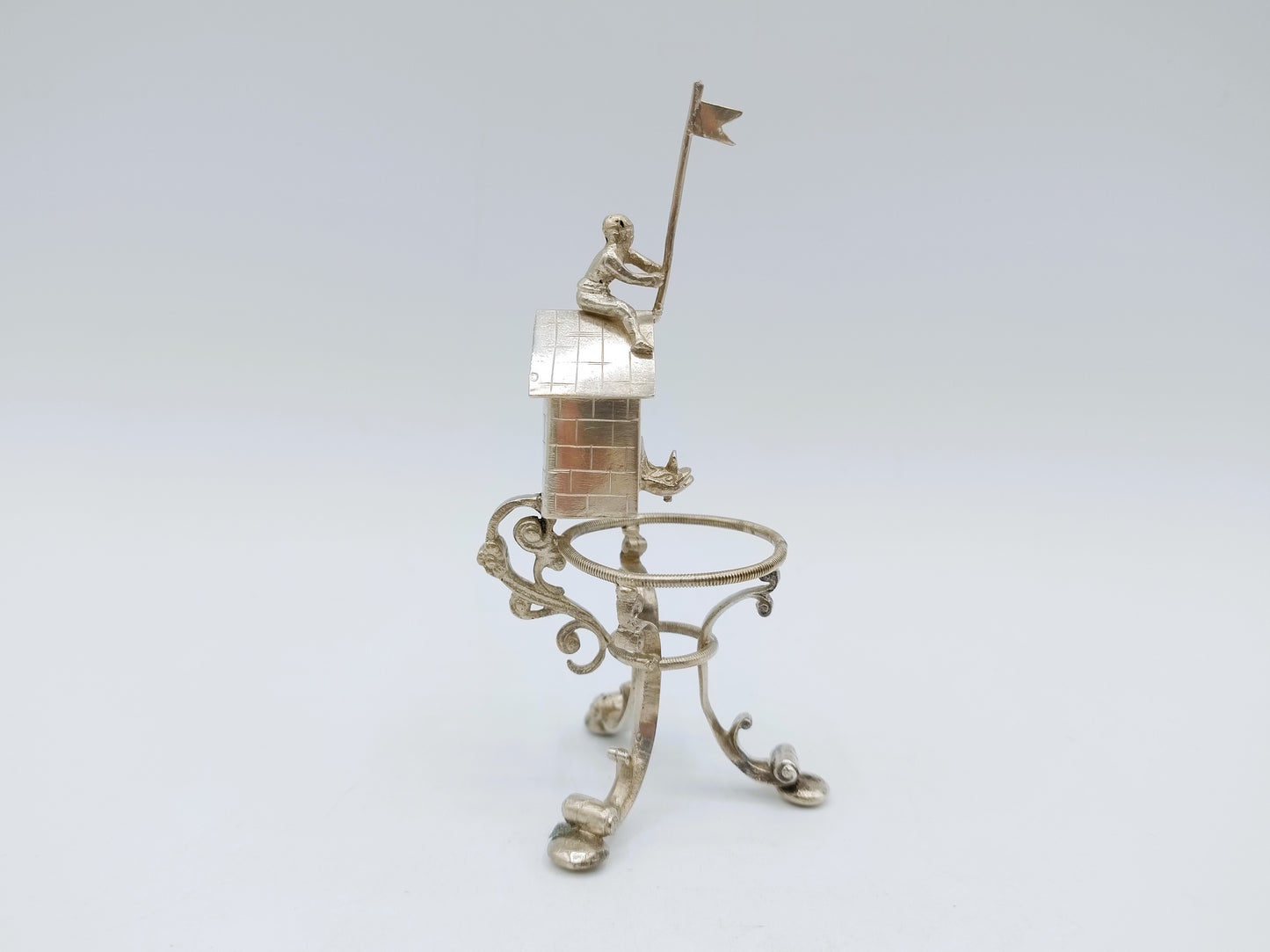 Silver miniature spring house with child, 19th century