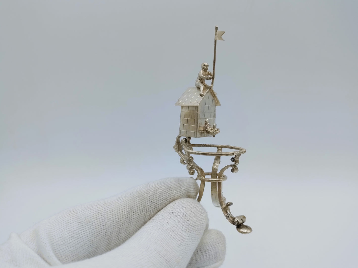 Silver miniature spring house with child, 19th century