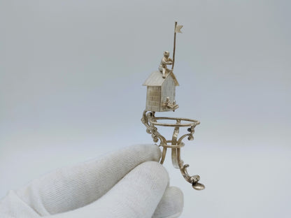 Silver miniature spring house with child, 19th century