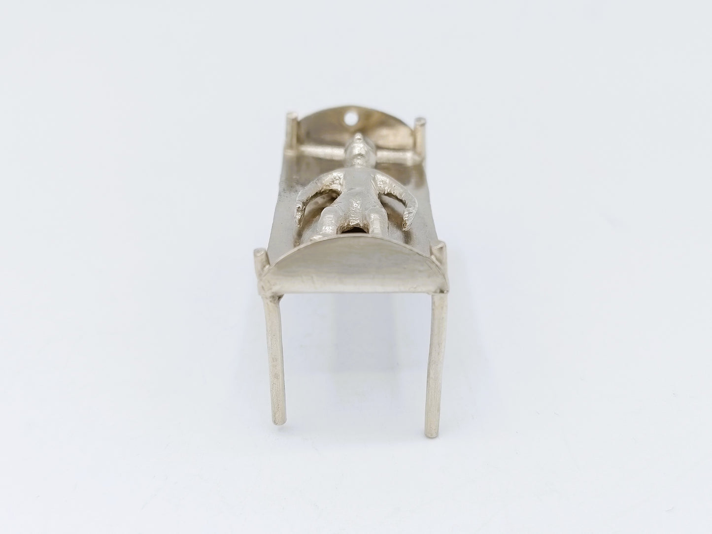 Silver miniature bed with figure, 18th century