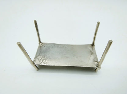 Silver miniature bed with figure, 18th century