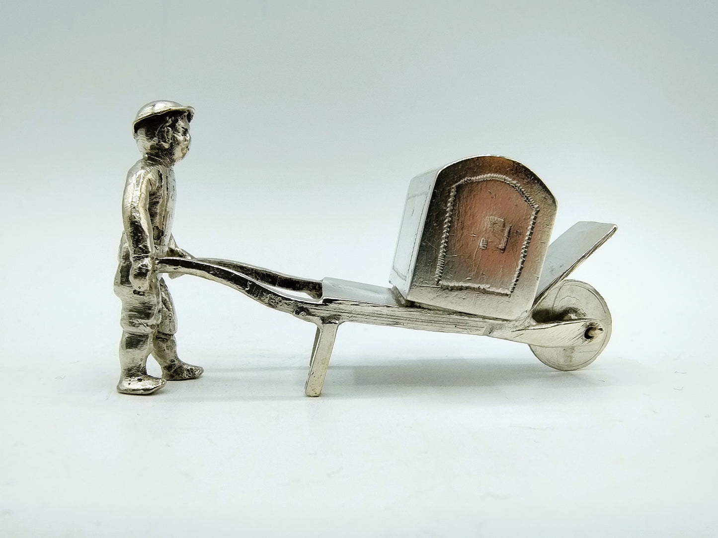 Silver miniature, man with wheelbarrow, 19th century