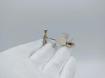 Silver miniature, man with wheelbarrow, 19th century