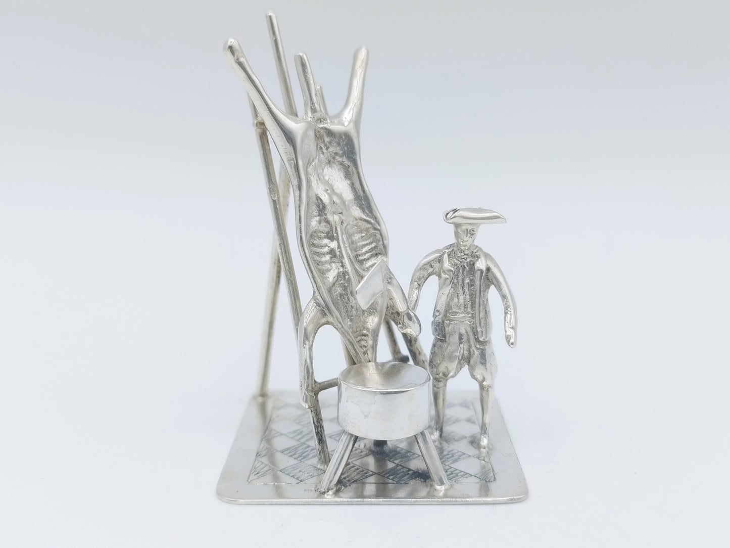 Silver miniature, butcher with pig on ladder, 18th century