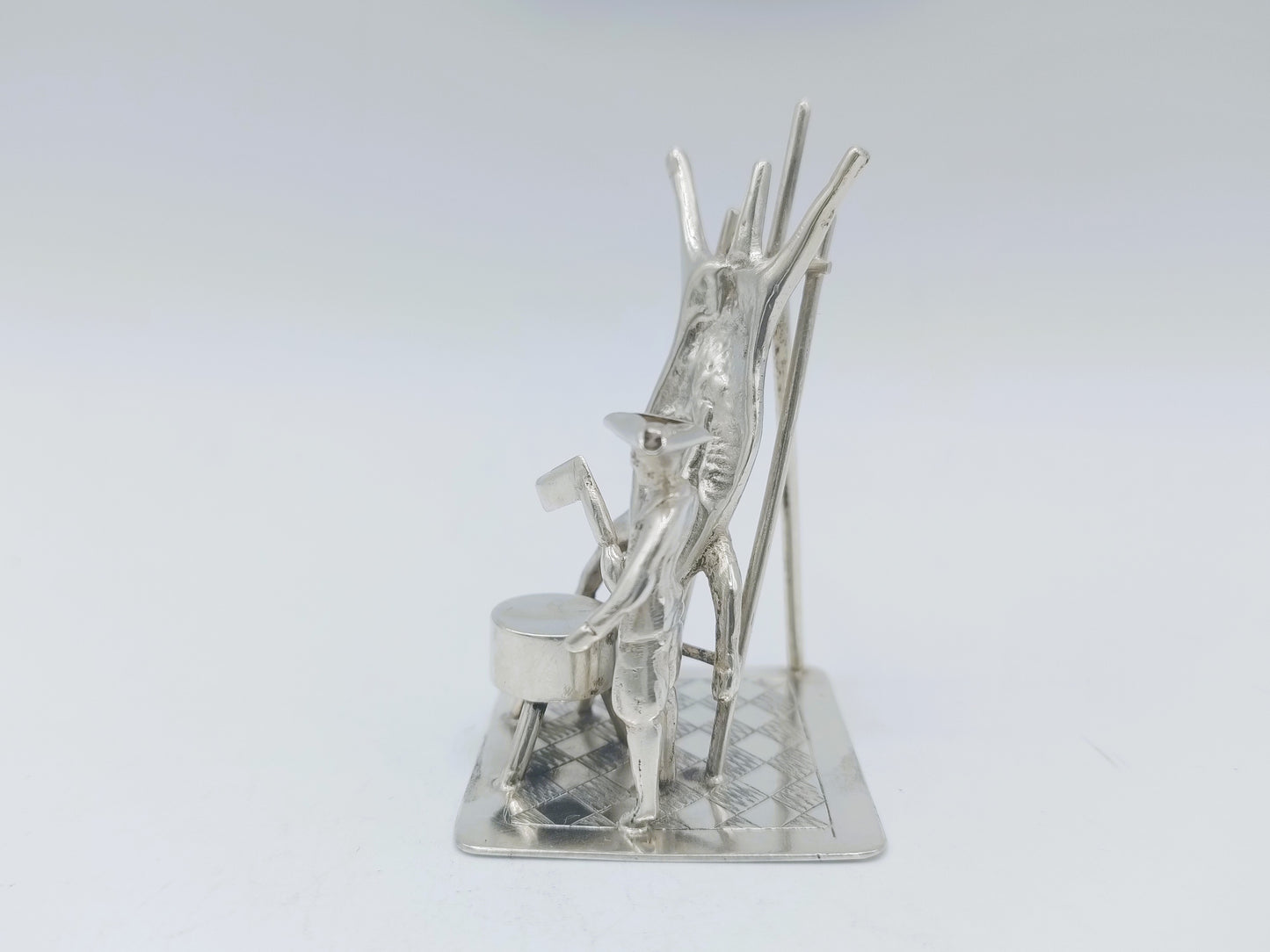 Silver miniature, butcher with pig on ladder, 18th century