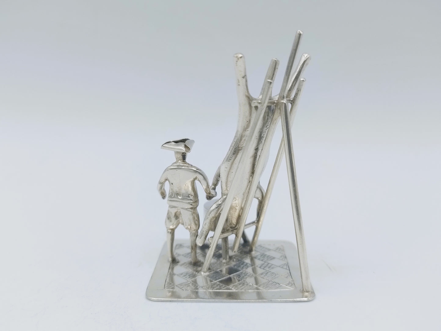 Silver miniature, butcher with pig on ladder, 18th century