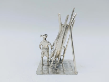 Silver miniature, butcher with pig on ladder, 18th century