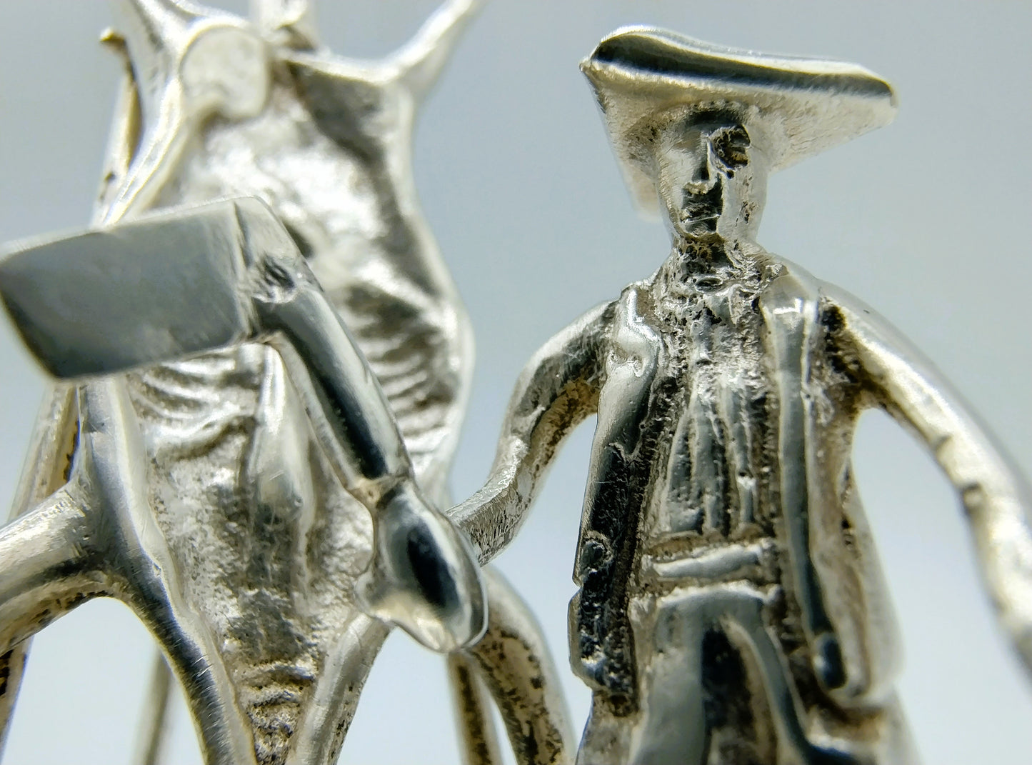 Silver miniature, butcher with pig on ladder, 18th century