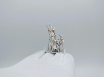 Silver miniature, butcher with pig on ladder, 18th century