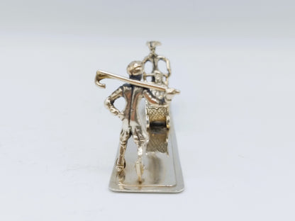 Zilveren miniatuur met slee en schaatser, 20e eeuws