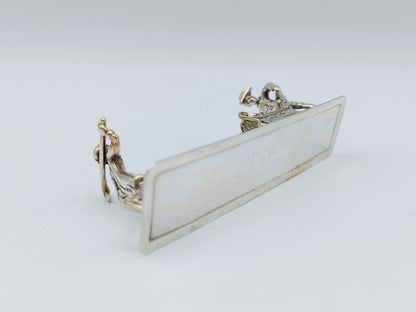 Zilveren miniatuur met slee en schaatser, 20e eeuws