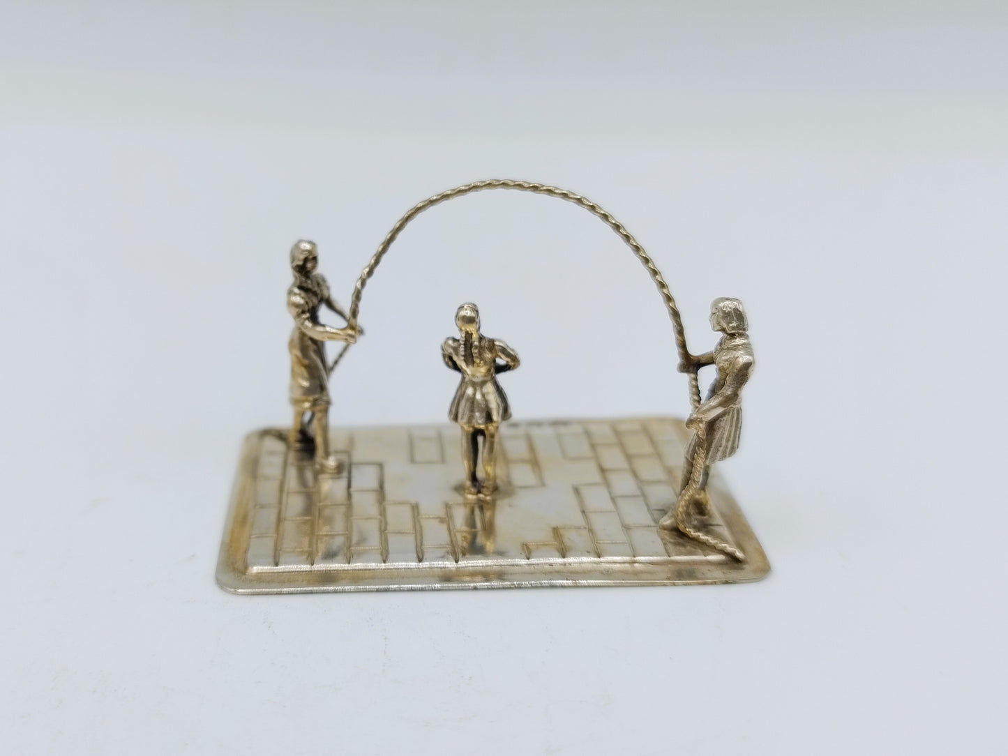 Zilveren miniatuur touwtje springen, Amsterdam, 1985