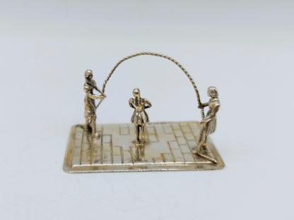 Zilveren miniatuur touwtje springen, Amsterdam, 1985