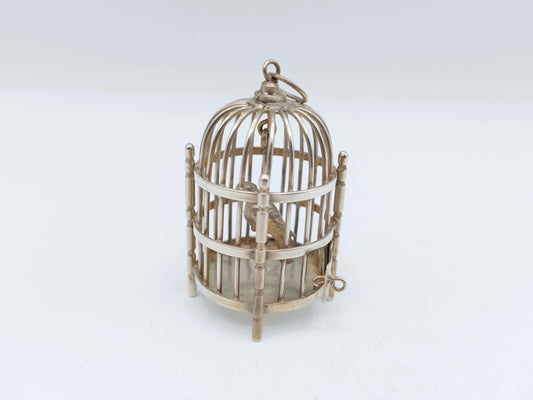 Zilverkleurige miniatuur vogelkooi met open koepel en ophangoog bovenaan