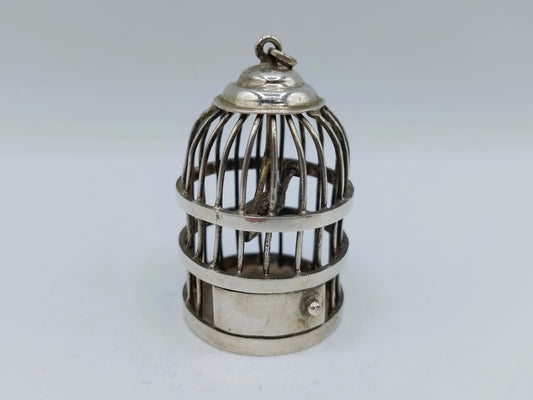 Zilveren miniatuur vogelkooi met koepeldak en metalen spijlen