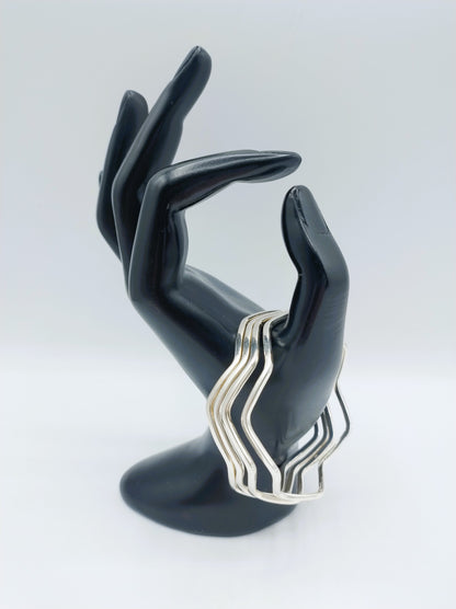 Set van 4 zilveren stervormige armbanden