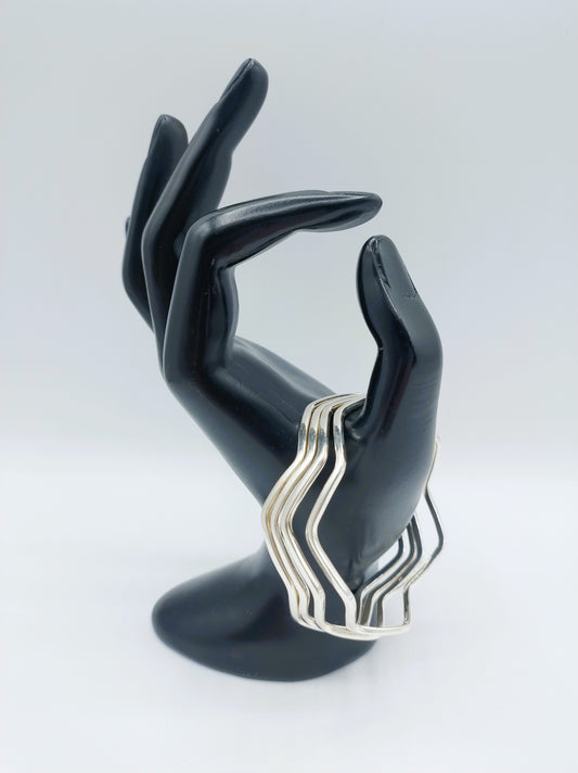 Set van 4 zilveren stervormige armbanden
