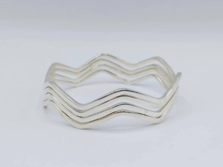 Set van 4 zilveren stervormige armbanden