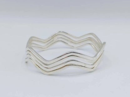 Set van 4 zilveren stervormige armbanden