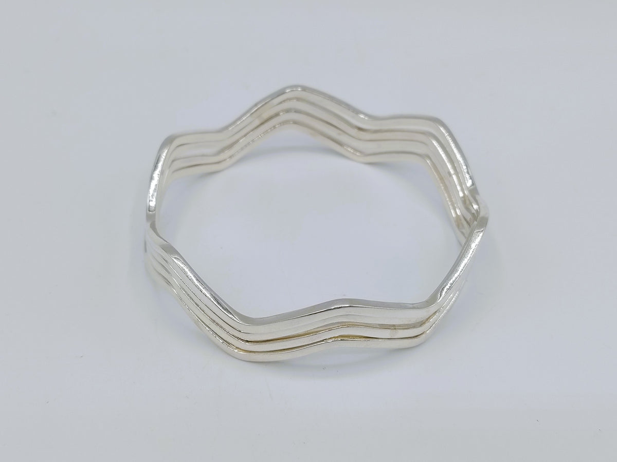 Set van 4 zilveren stervormige armbanden