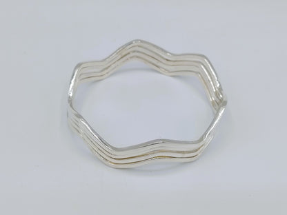 Set van 4 zilveren stervormige armbanden