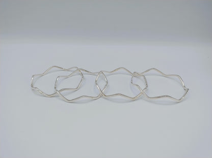 Set van 4 zilveren stervormige armbanden