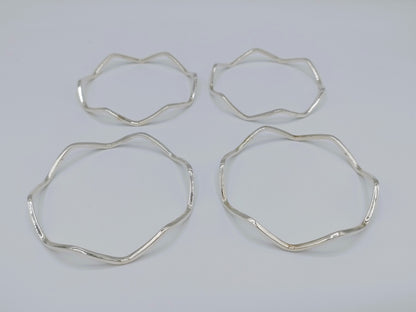 Set van 4 zilveren stervormige armbanden