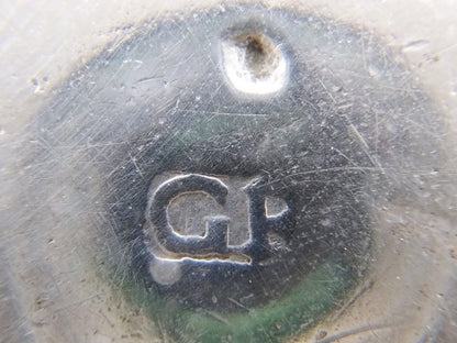 Zilveren stempel op punchlepel, gemarkeerde ronding