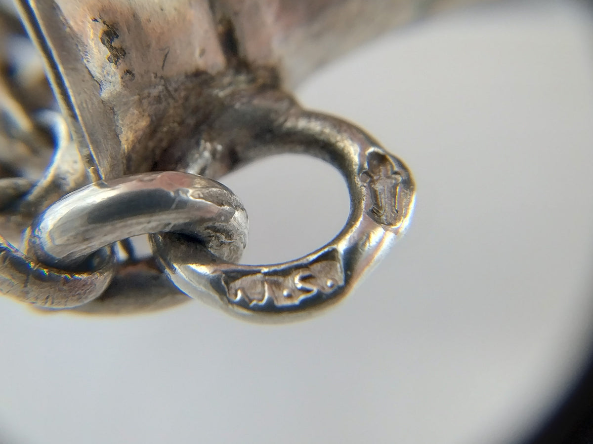 Zilveren breipendoppen aan jasseronketting. IJbele Steensma, Bergum, ca. 1930