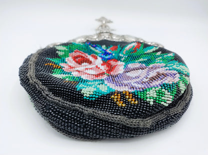 Zwarte borduurwerk tasbeugel met kleurrijke bloemen en zilveren bovenklem