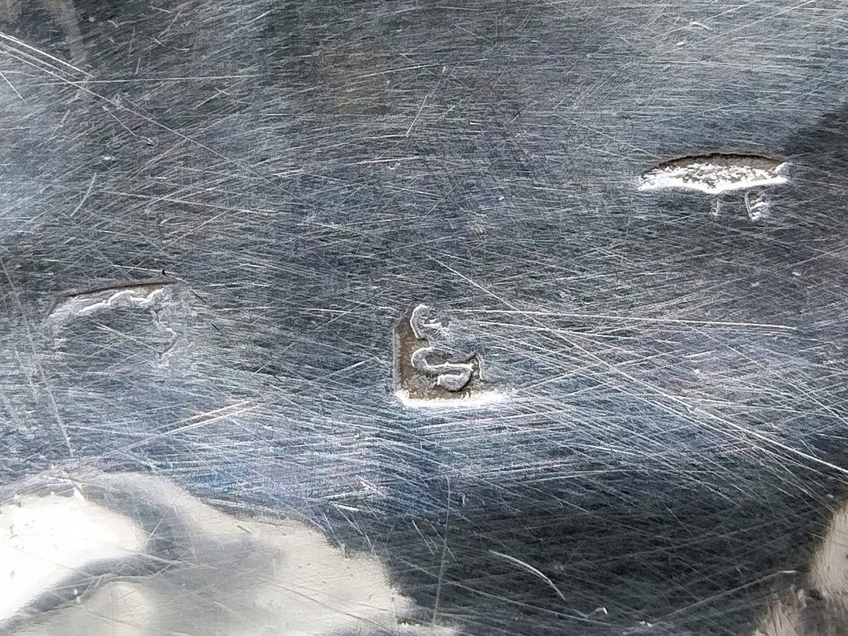 Detail van zilvermerken op de punchlepel