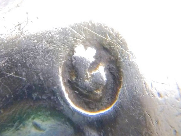 Zilveren lepel, detail van een ingeslagen keurmerk