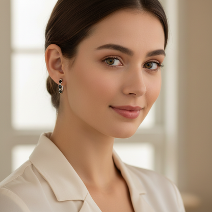 Silver hoop earrings with black stones